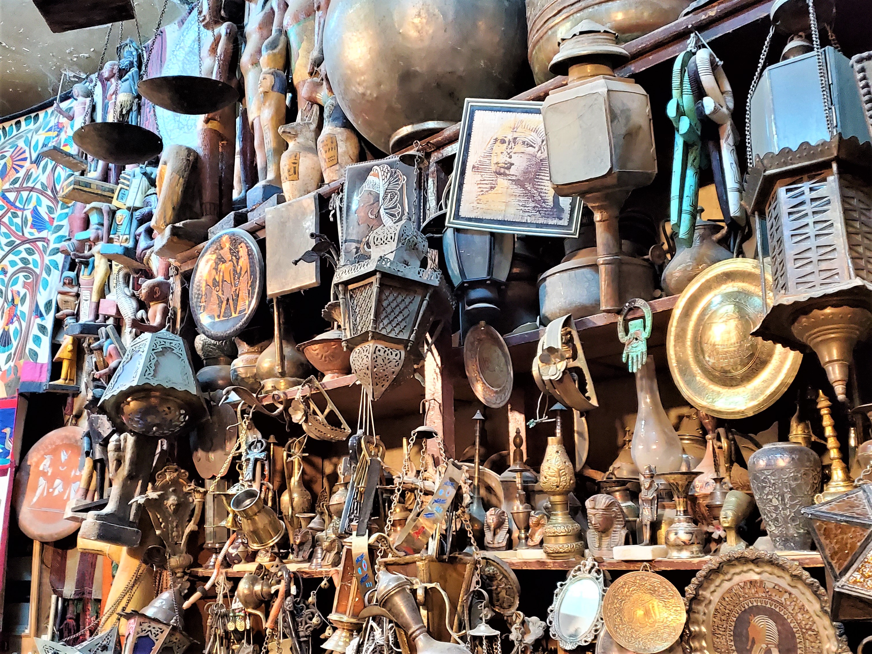 Egyptian marketplace clutter brass hanging lamps and other things for sale
