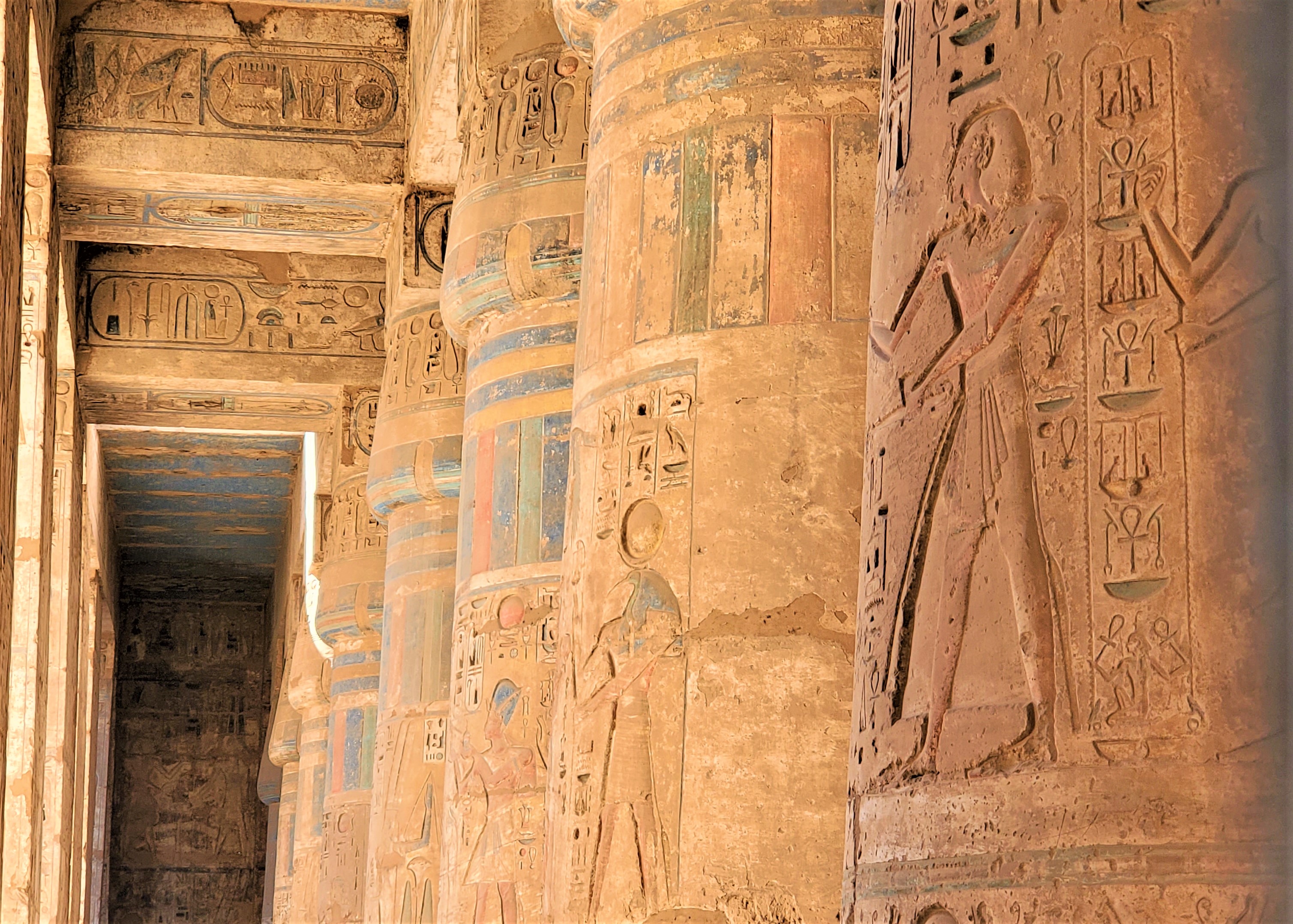 Some beautiful colors on a row of columns at Medinet Habu Temple in Luxor, Egypt
