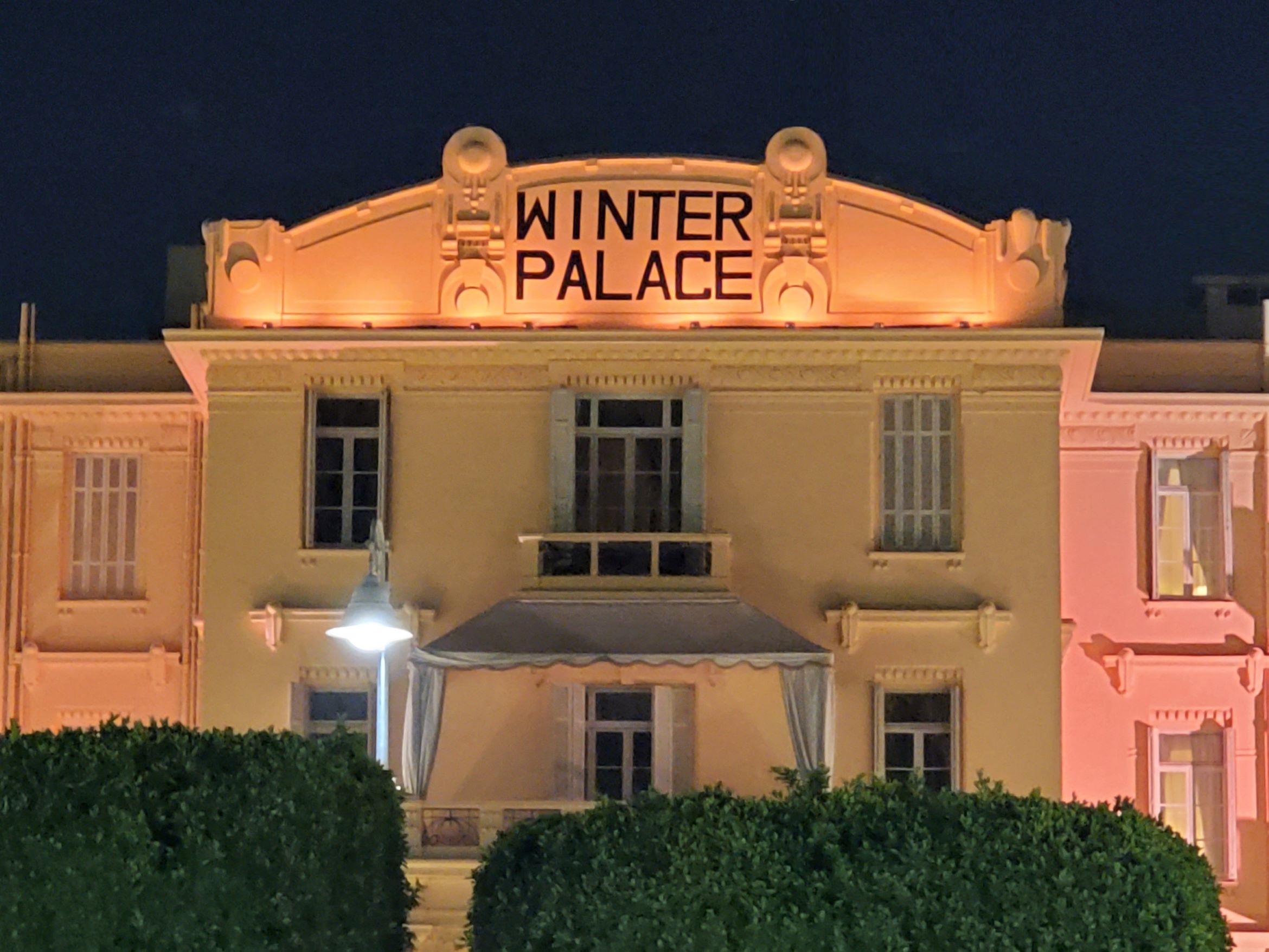 The front of the Old Winter Palace Hotel at Night